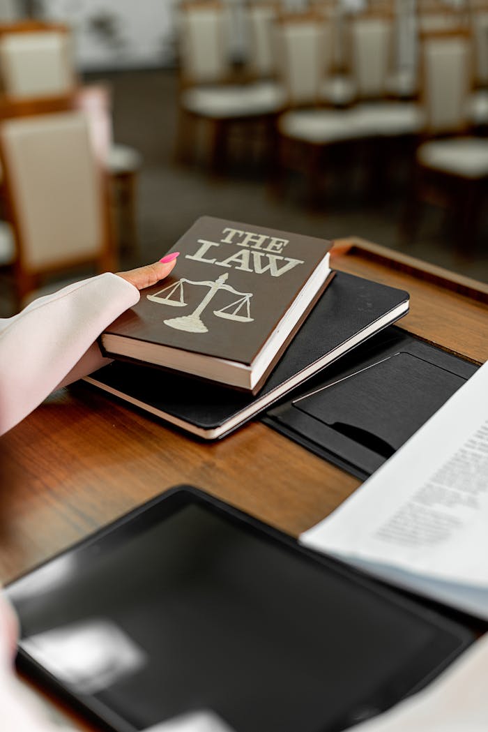 Close-up of a law book on a podium in a conference setting, symbolizing legal knowledge.
